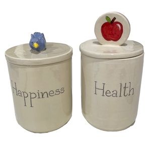 Vintage decorative Our Name is Mud porcelain canisters with lids.